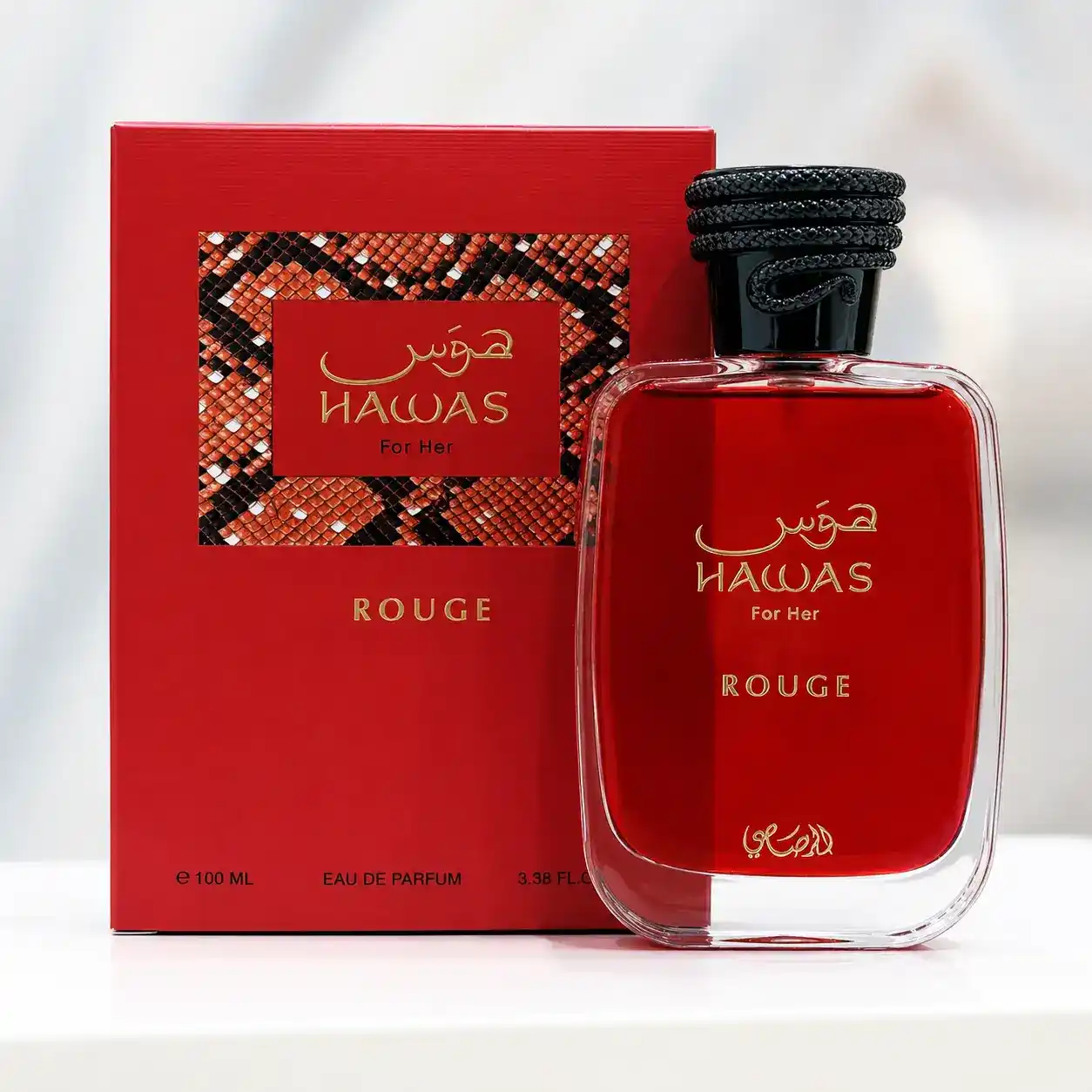 Rasasi Hawas Rouge rodeado de pera y bergamota